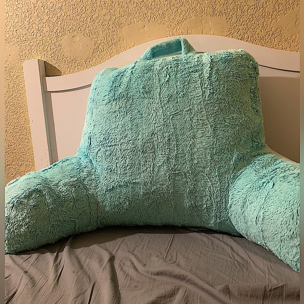 Blue bed rest pillow with arms